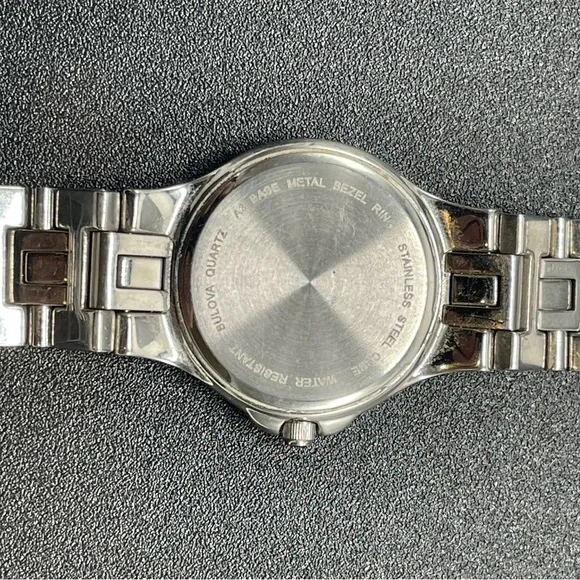 Bulova 96R04 with gemmed bezel, Roman Numerals, and Date Window
